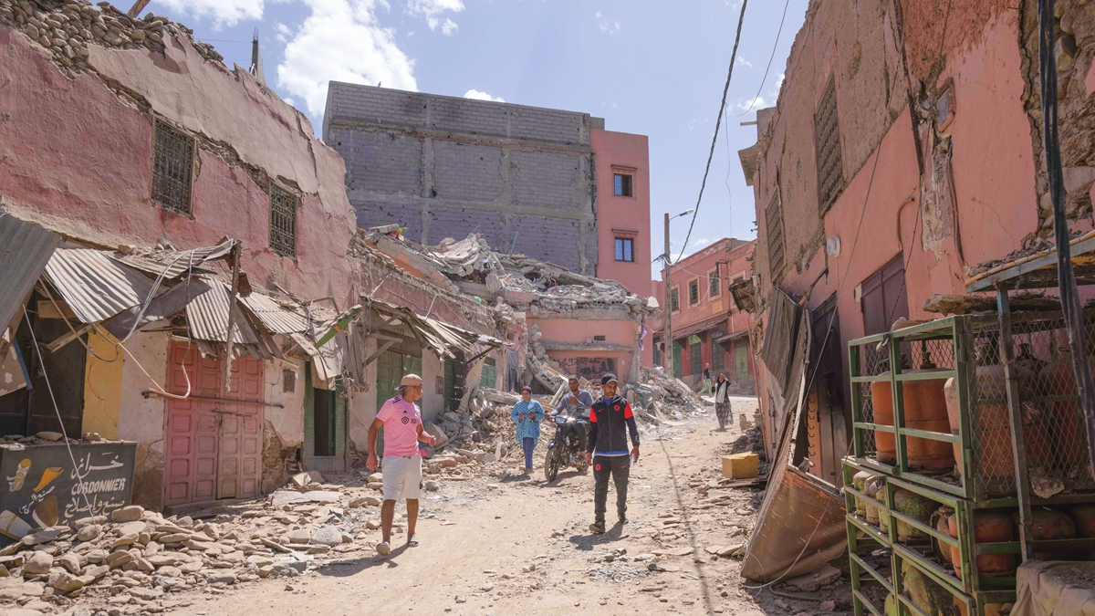 People assess the post-earthquake damage to buildings in Amizmiz, Morocco, September 10, 2023. /VCG