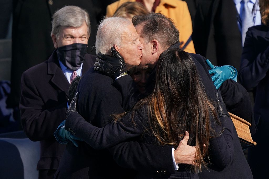 U.S. President Joe Biden is hugged by his children, Hunter and Ashley, after he was sworn in as the 46th president of the United States at the U.S. Capitol in Washington, D.C., January 20, 2021. /CFP