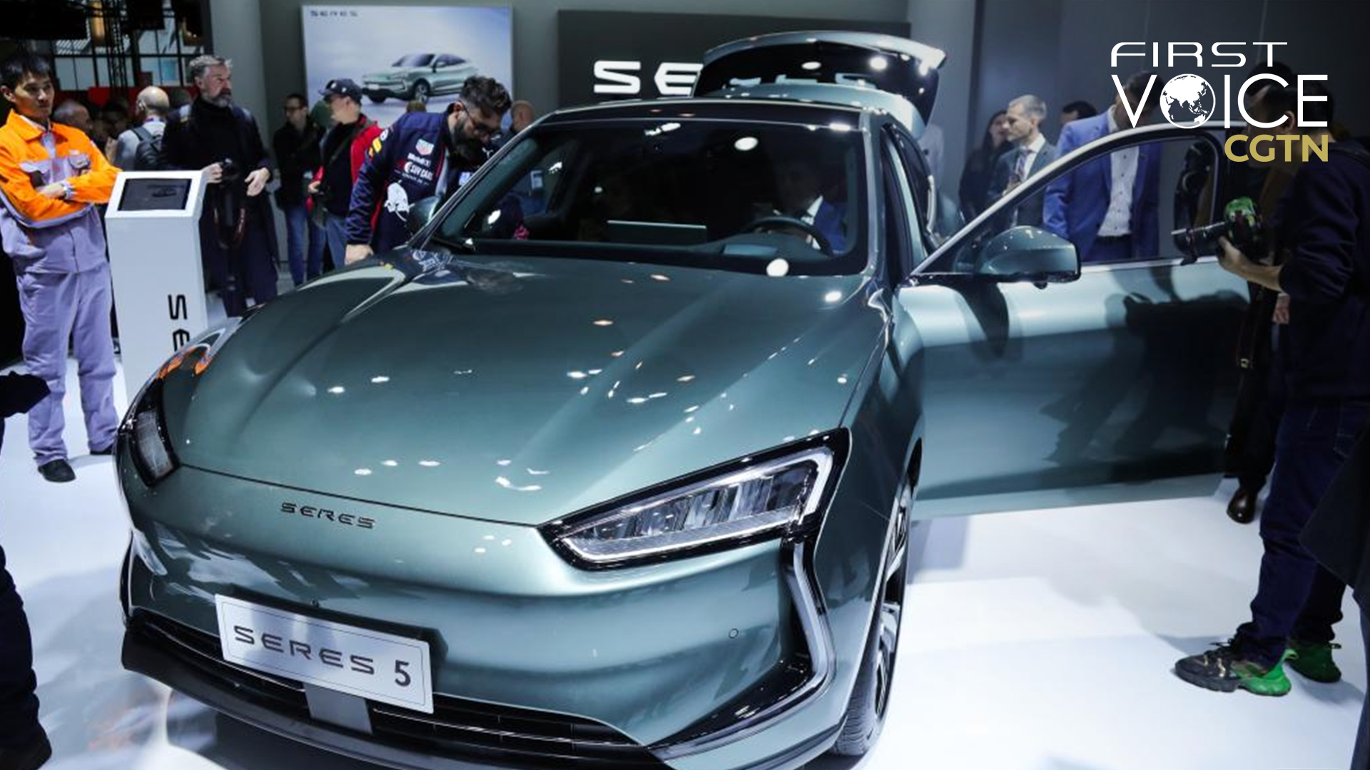 People experience a Seres 5 electric car during a media preview of the 100th Brussels Motor Show in Brussels, Belgium, January 13, 2023. /Xinhua