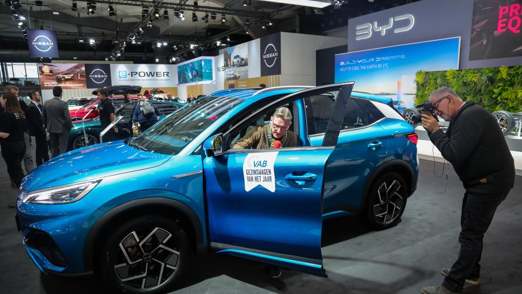 Journalists make report on a BYD Atto 3 electric car during a media preview of the 100th Brussels Motor Show in Brussels, Belgium, January 13, 2023. /Xinhua