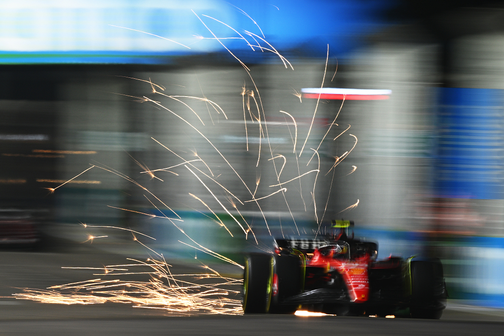 Sparks fly from the car of Carlos Sainz driving the Ferrari SF-23 race car during practice ahead of the F1 Grand Prix of Singapore at Marina Bay Street Circuit in Singapore, September 15, 2023. /CFP