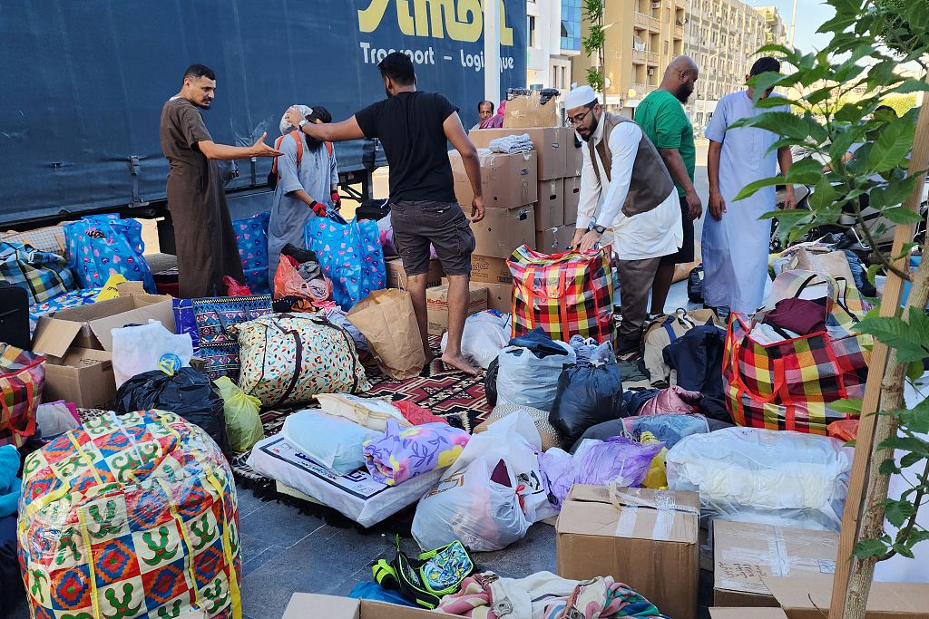People bring donated supplies to a collection point in Libya's capital Tripoli, September 15, 2023. /CFP