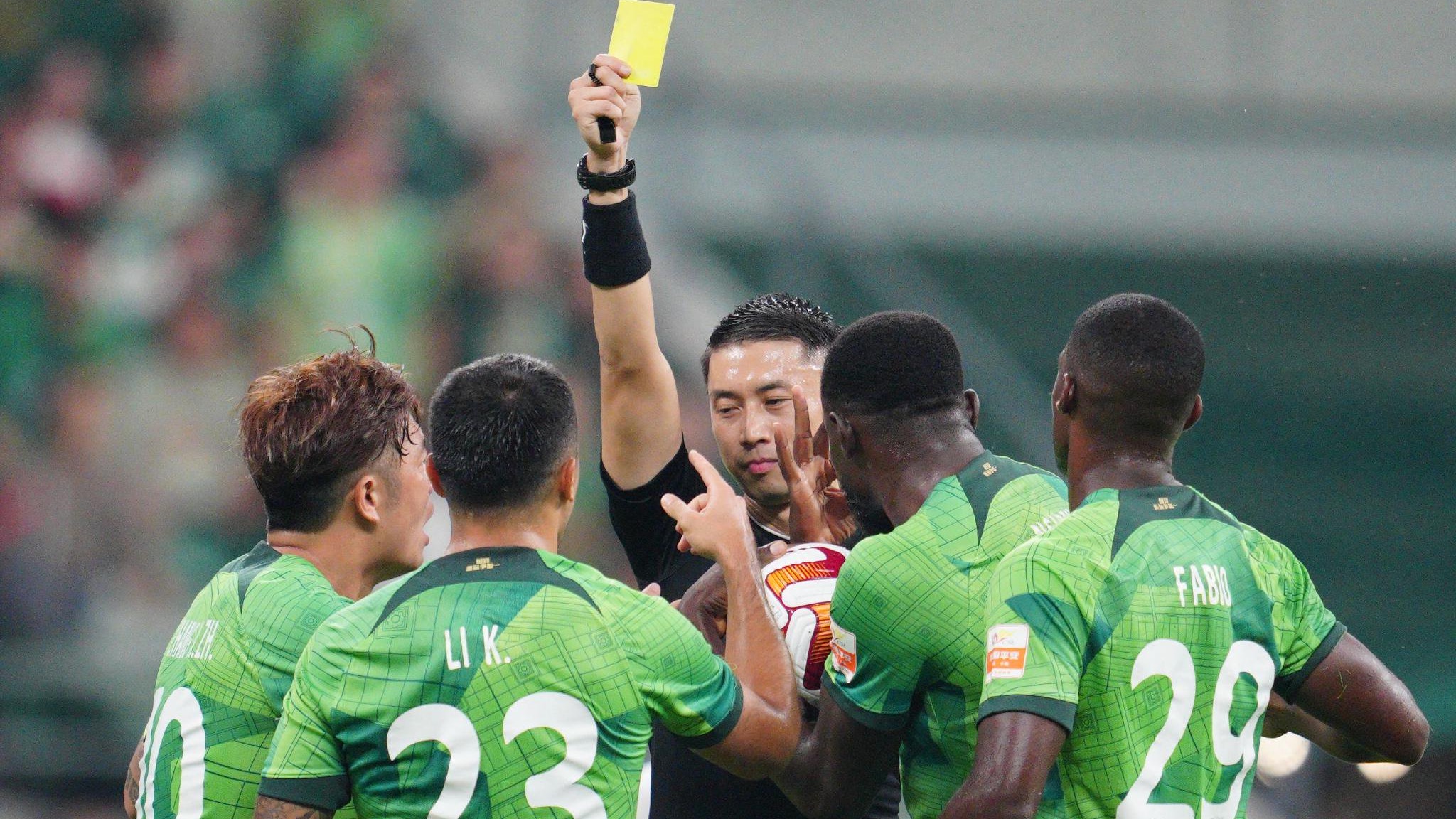 Beijing Guoan players react after the referee shows a yellow card during their Chinese Super League clash with Zhejiang FC at the new Workers' Stadium in Beijing, China, September 15, 2023. /Beijing Guoan