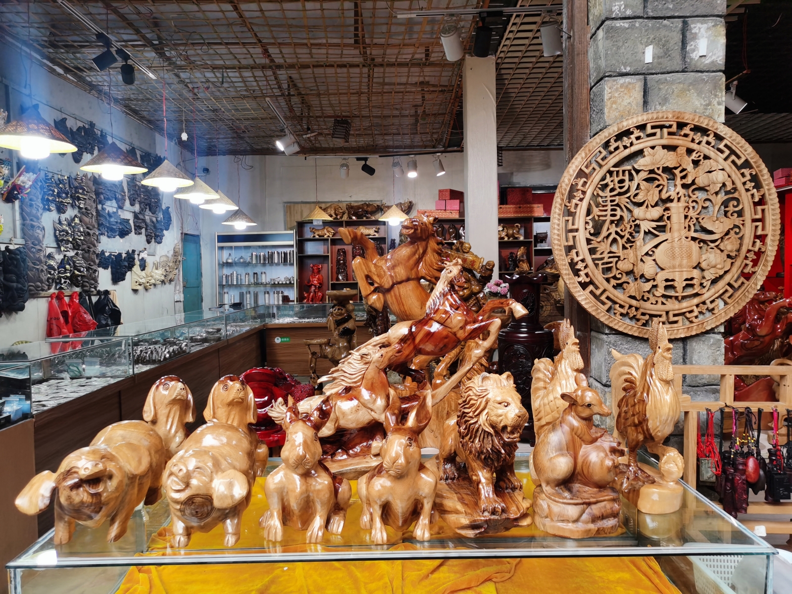 Wood carvings are on sale at a shop in Tianlong Tunpu town in Anshun, southwest China's Guizhou Province on August 27, 2023. /CGTN