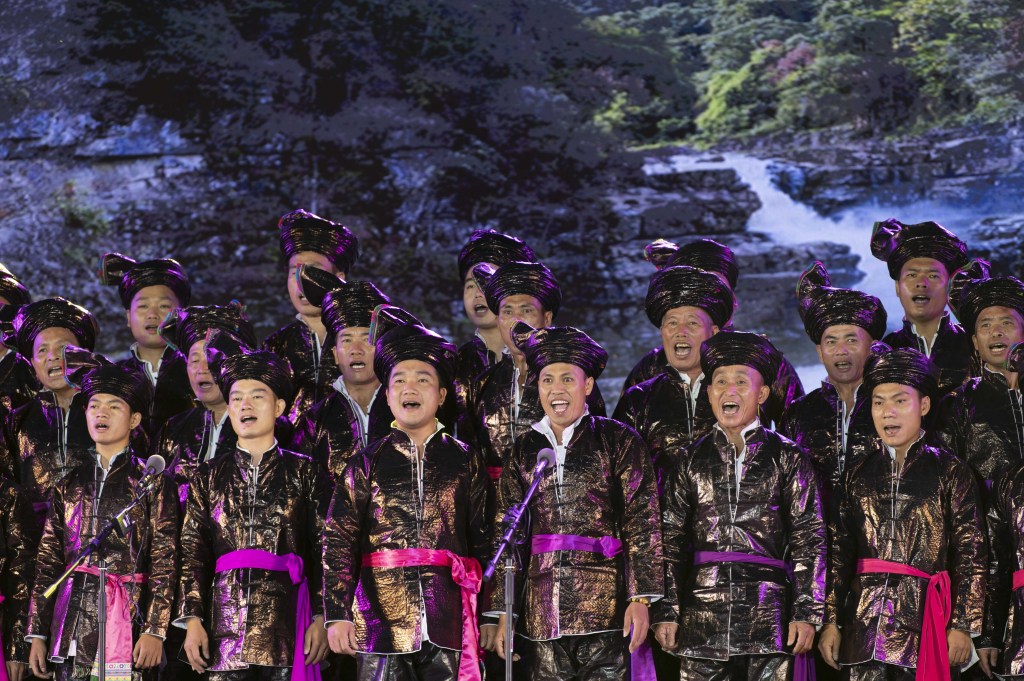 People from the Miao and Dong ethnic groups wearing traditional costumes stage performances to embrace the upcoming Mid-Autumn Festival in Congjiang County, southwest China's Guizhou Province, September 16, 2023. /CFP