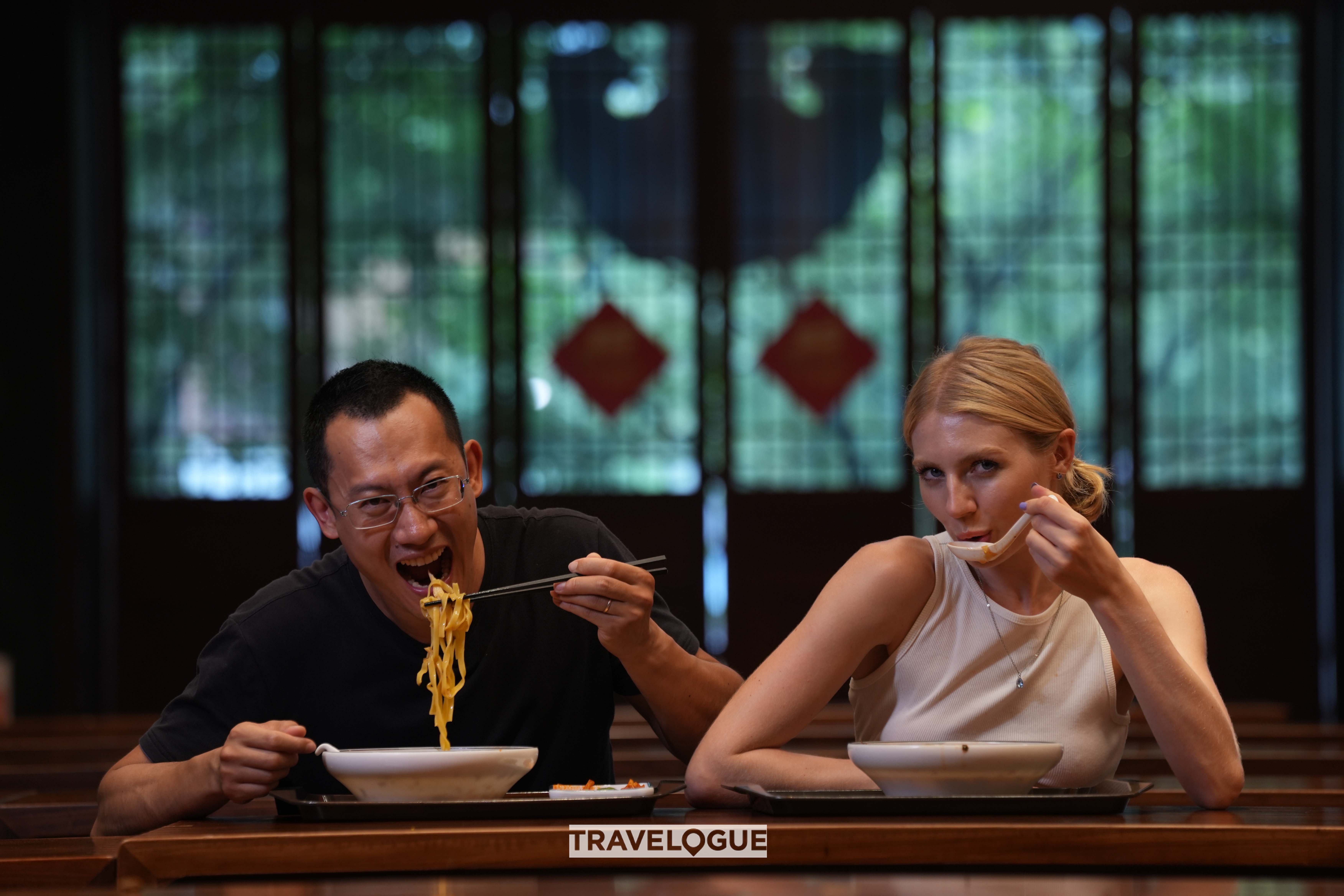 Visitors enjoy vegan noodle dishes at the Jingshan Temple in Hangzhou, Zhejiang Province. /CGTN
