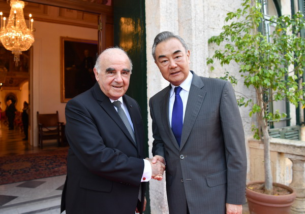 Wang Yi (R), director of the Office of the Foreign Affairs Commission of the CPC Central Committee, shakes hands with Maltese President George Vella at the presidential palace in Valletta, Malta, September 17, 2023. /Chinese Foreign Ministry