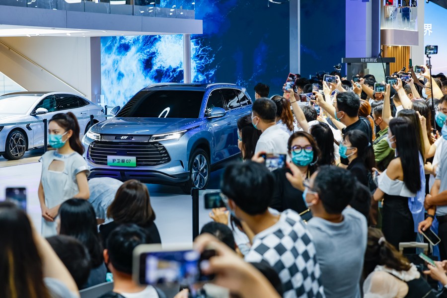 Visitors take photos of a car from BYD at the Chengdu Motor Show 2022 in Chengdu, capital of southwest China's Sichuan Province, August 26, 2022. /Xinhua