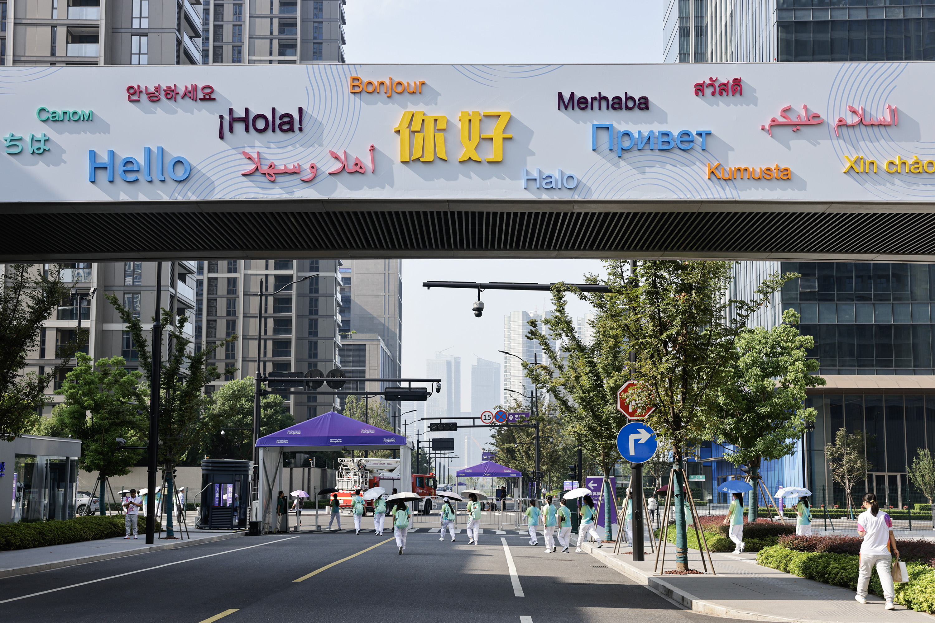 A photo shows a sign welcoming visitors in various languages displayed at an Asian Games venue on September 18, 2023, in Hangzhou, Zhejiang. /IC