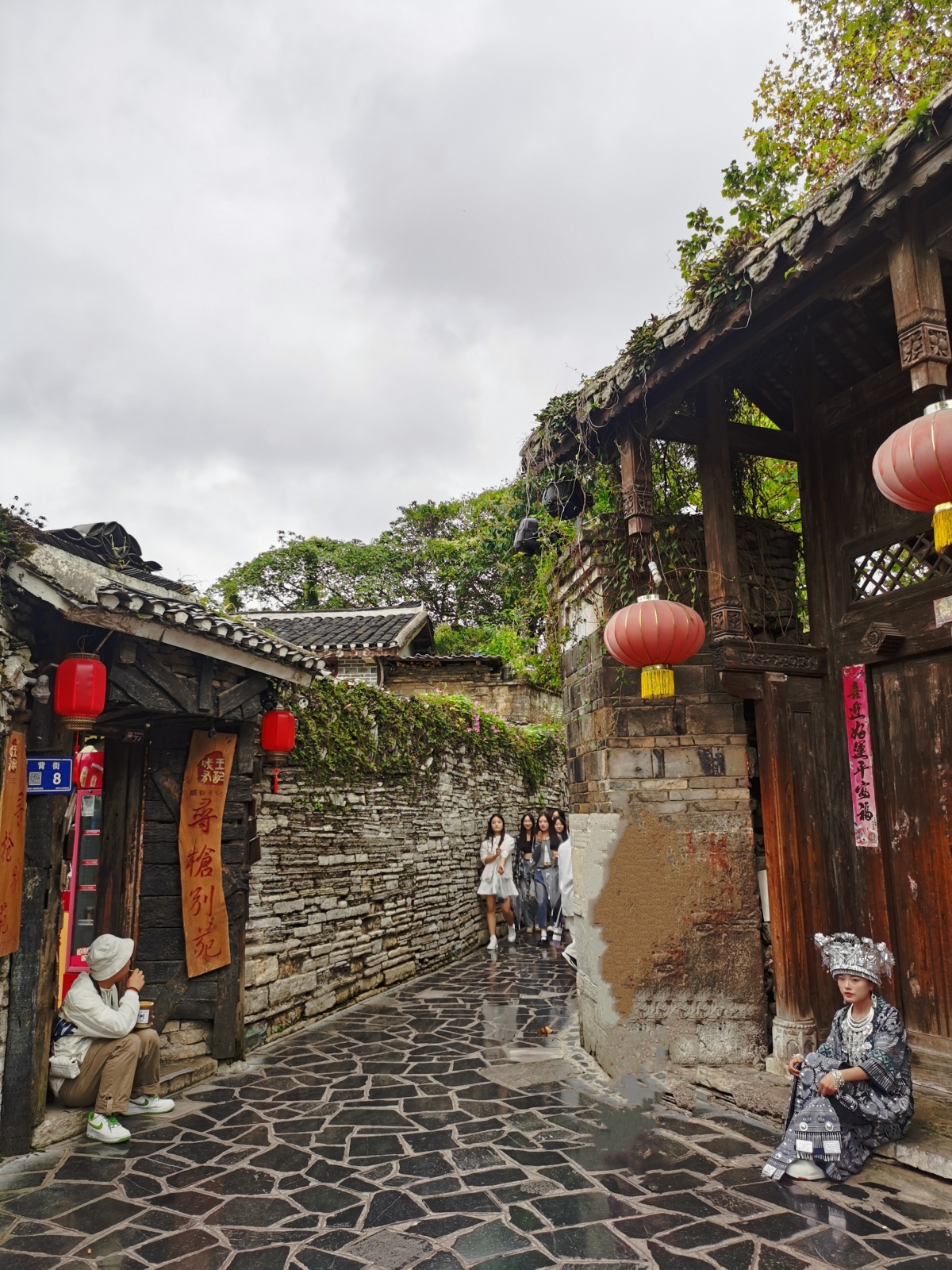 Tourists visit Qingyan ancient town in Guiyang, southwest China's Guizhou Province, on August 28, 2023. /CGTN