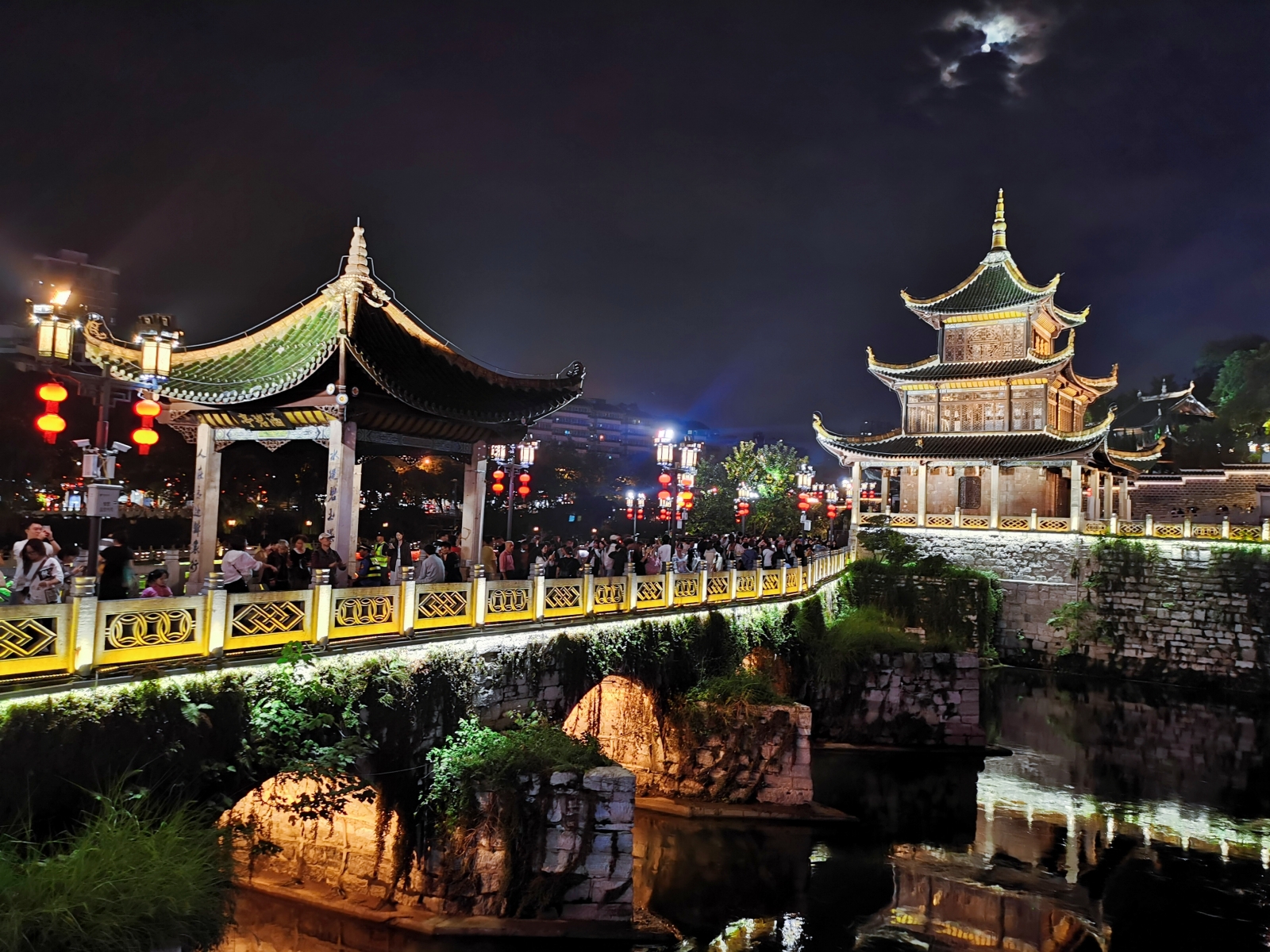 Tourists admire night views of the Jiaxiu Pavilion in Guiyang, southwest China's Guizhou Province, on August 28, 2023. /CGTN