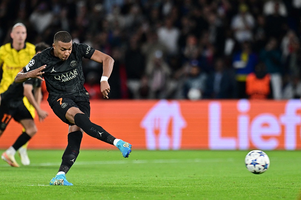 PSG's Kylian Mbappe shoots a penalty kick during their UEFA Champions League clash with Borussia Dortmund at the Parc des Princes stadium in Paris, France, September 19, 2023. /CFP