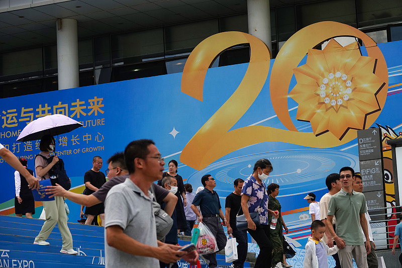 Visitors walk out of Nanning International Convention and Exhibition Center, the venue of China-ASEAN Expo, September 19, 2023. /CFP