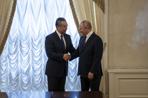 Russian President Vladimir Putin (R) shakes hands with Wang Yi, a member of the Political Bureau of the Communist Party of China Central Committee and director of the Office of the Central Commission for Foreign Affairs, in St. Petersburg, Russia, September 20, 2023. /Chinese Foreign Ministry 