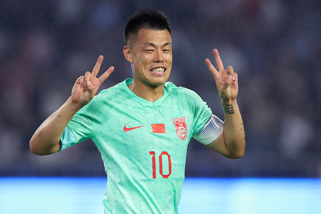 Tan Long of China celebrates after scoring a goal in the men's football group game against Myanmar in the 19th Asian Games in Hangzhou, east China's Zhejiang Province, September 21, 2023. /CFP
