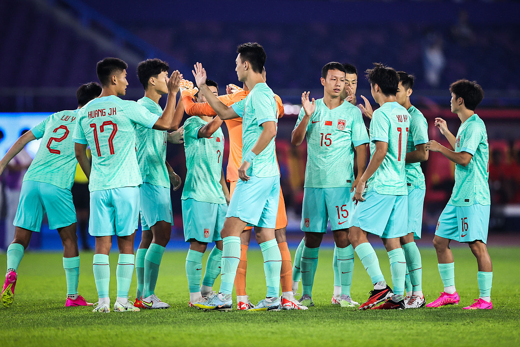 Players of China celebrate their 4-0 win over Myanmar in the men's football group game in the 19th Asian Games in Hangzhou, east China's Zhejiang Province, September 21, 2023. /CFP