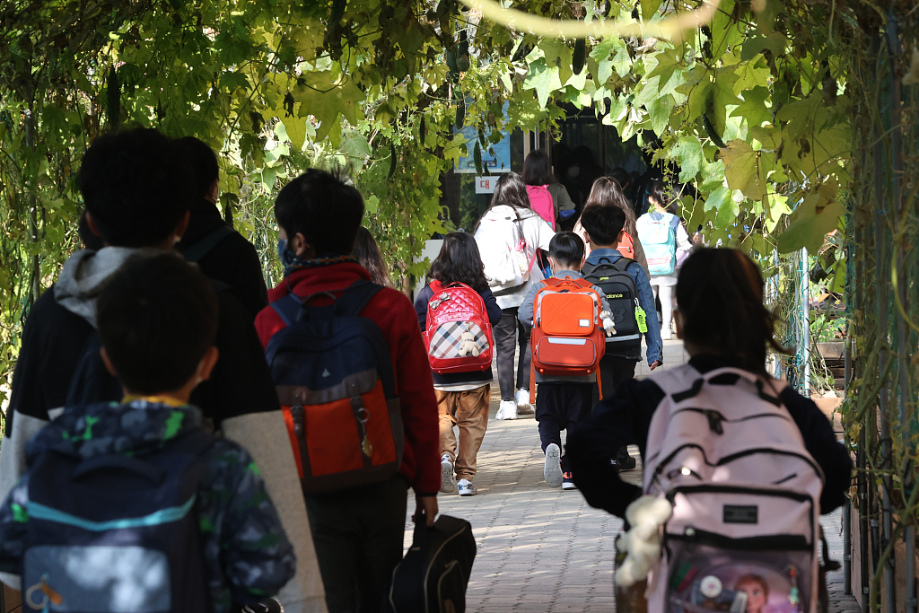 FILE: Students on their way to school in Seoul, South Korea. October 19, 2020. /CFP