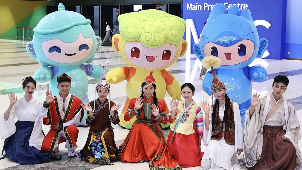 Volunteers and mascots pose inside the Main Media Center for the Hangzhou Asian Games in Zhejiang Province, China, September 18, 2023. /CFP