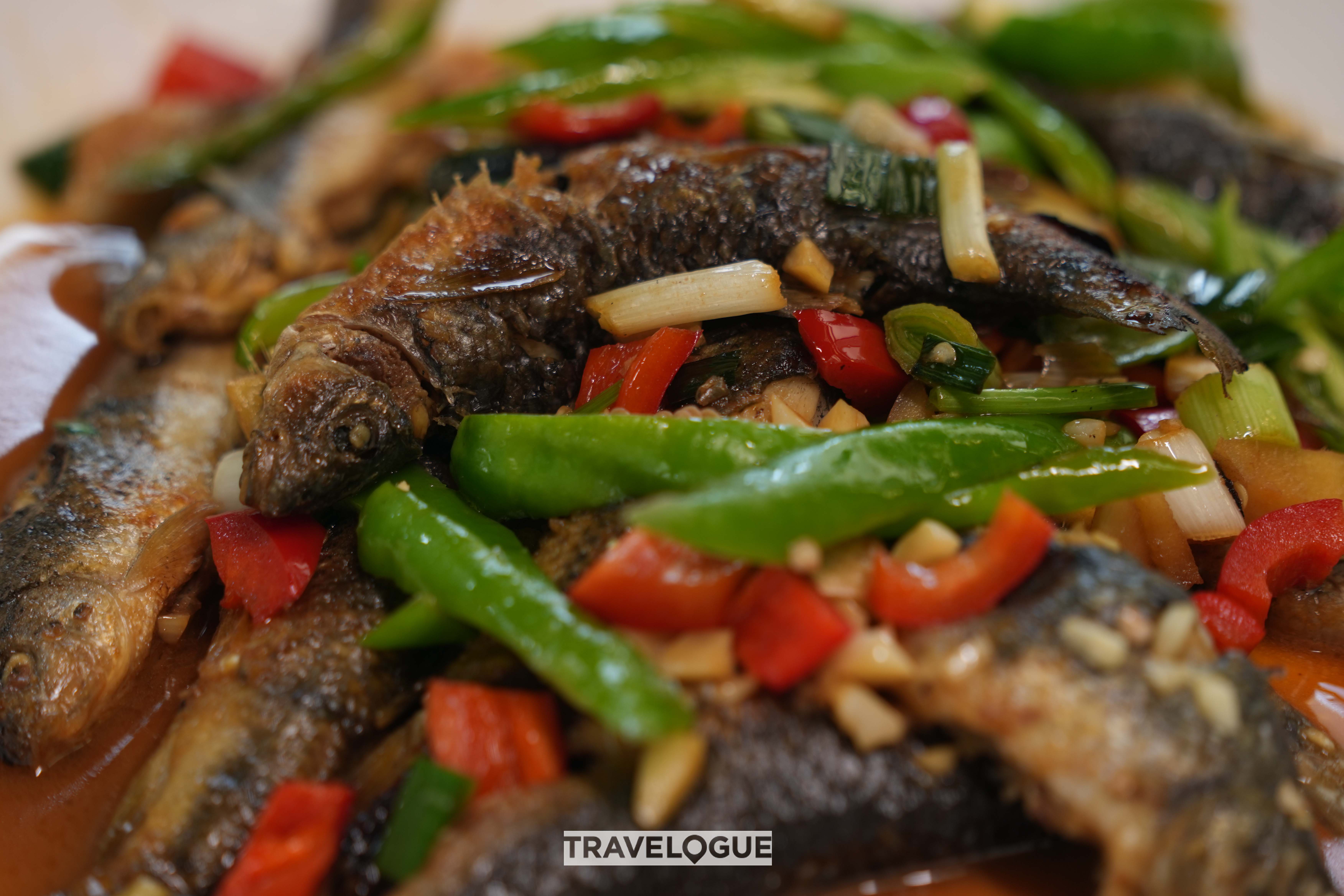 Braised Shishe Village river fish with fresh chili /CGTN