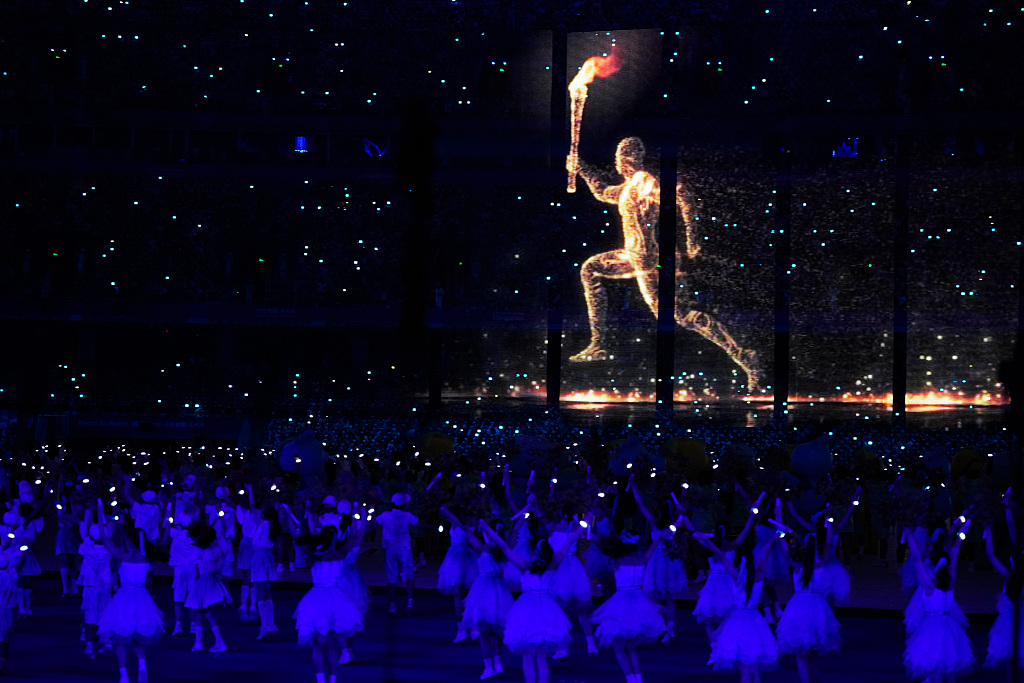 A view of a digital torch bearer running at the opening ceremony for the 19th Asian Games in Hangzhou, east China's Zhejiang Province, September 23. /CFP