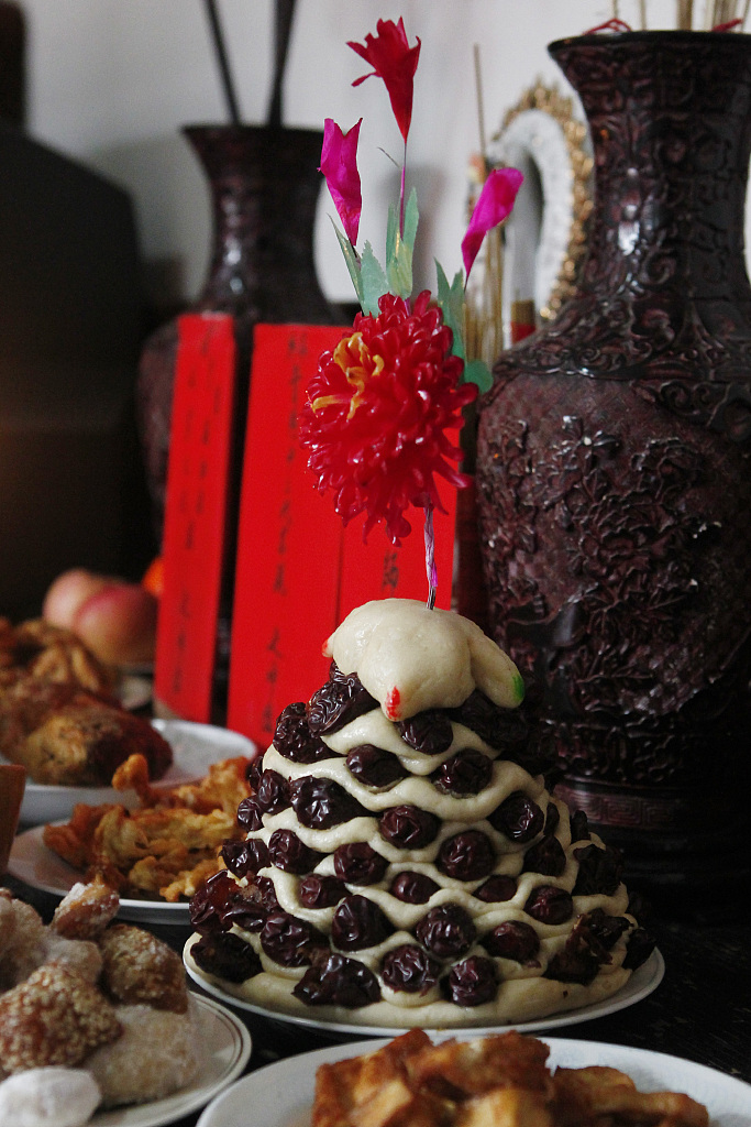 File photo shows a zaohuagao ready to eat on a table in Qufu, Shandong Province, China. /CFP