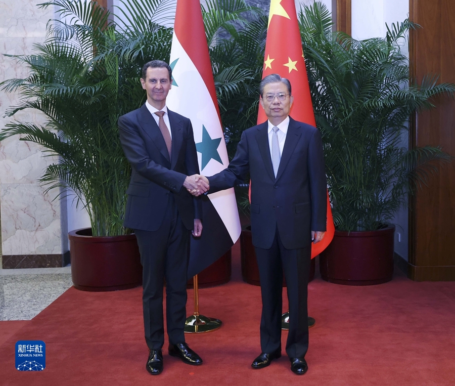 Chairman of the National People's Congress Standing Committee Zhao Leji (R) shakes hands with Syrian President Bashar al-Assad in Beijing, China, September 25, 2023. /Xinhua