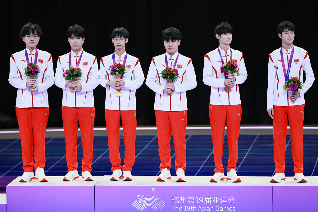 Gold medalists of China pose for a photo after defeating Malaysia 2-0 in the Arena of Valor Asian Games Version final at the 19th Asian Games in Hangzhou, east China's Zhejiang Province, September 26, 2023. CFP