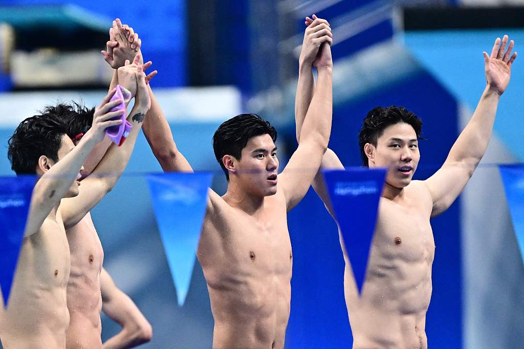 Swimmers of China celebrate their victory in the men's 4x100-meter medley relay final at the 19th Asian Games in Hangzhou, east China's Zhejiang Province, September 26, 2023. CFP