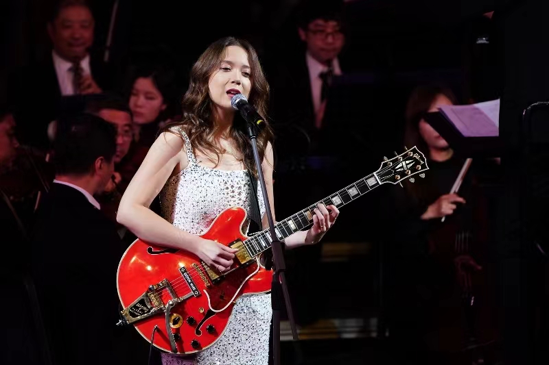 Laufey Lin, a young musician who was born in 1999 to an Icelandic father and a Chinese mother, performs on stage with the China Philharmonic Orchestra during her maiden show in the Chinese capital on September 26, 2023. /Photo provided to CGTN