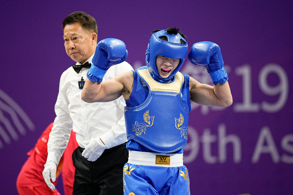 China's Li Yueyao reacts after winning the women's Sanda 52kg final in the 19th Asian Games in Hangzhou, Zhejiang Province, China, September 28, 2023. /CFP