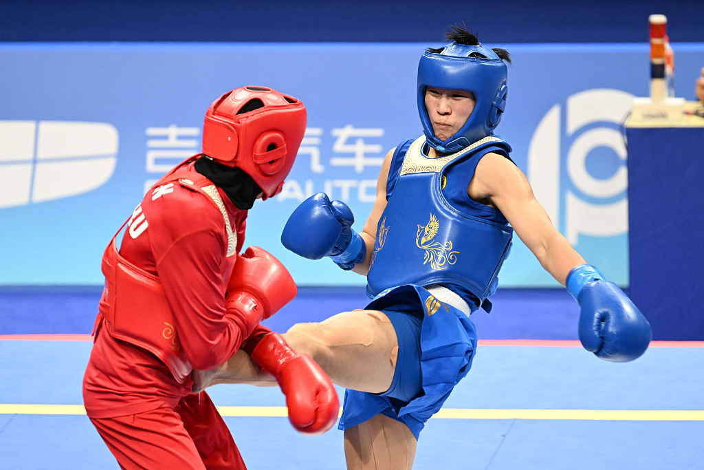 China's Li Yueyao (R) during the women's Sanda 52kg final in the 19th Asian Games in Hangzhou, Zhejiang Province, China, September 28, 2023. /CFP