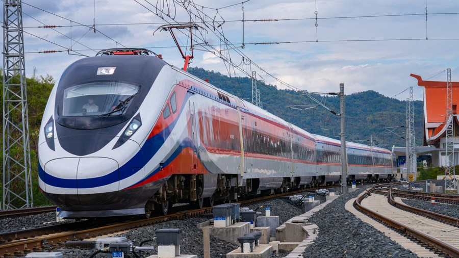 The Lane Xang passenger train of the China-Laos Railway runs past a maintenance center in Luang Prabang, Laos, March 30, 2023. /Xinhua