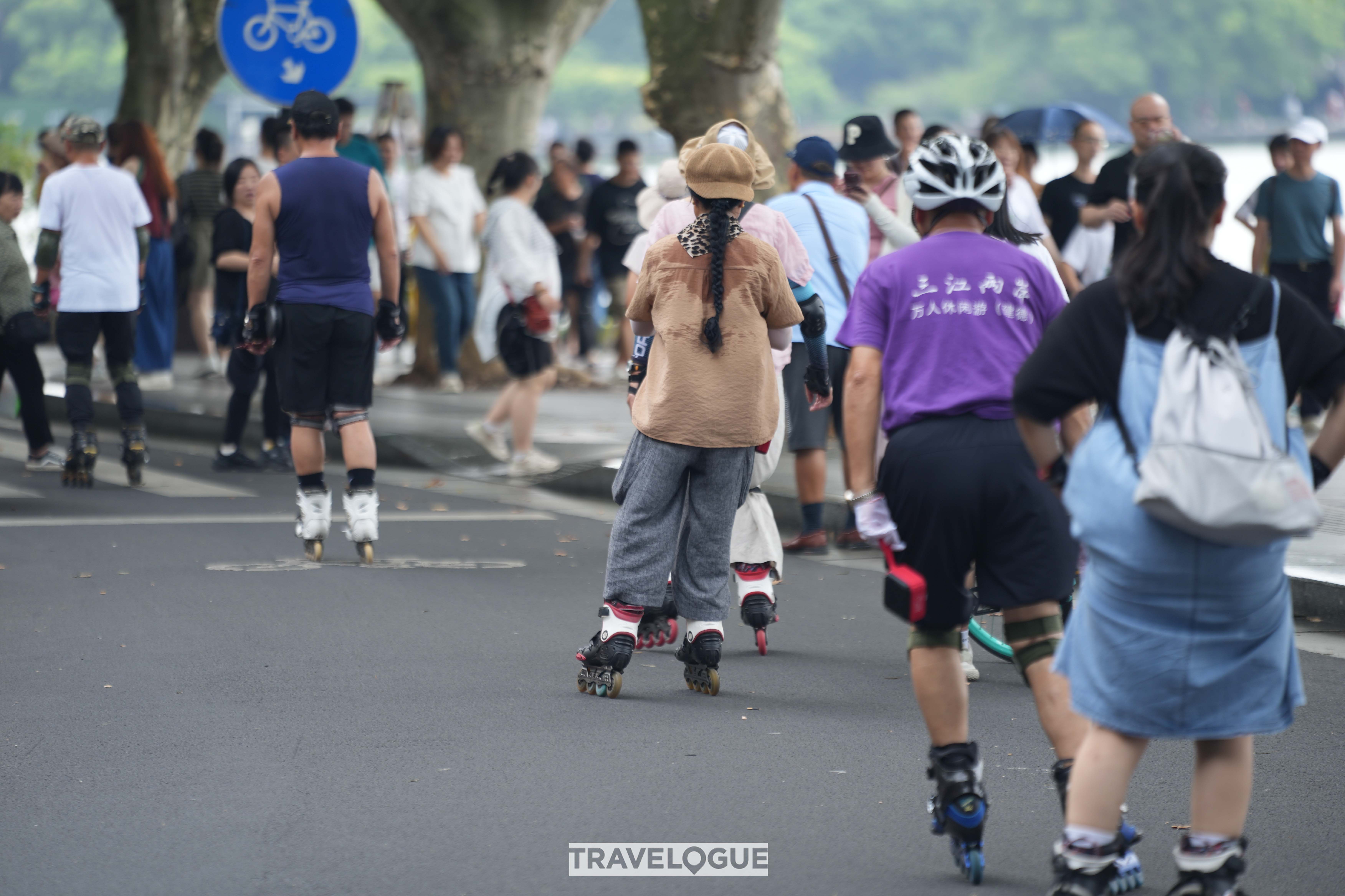 Residents skate near the iconic West Lake in Hangzhou, Zhejiang Province. /CGTN