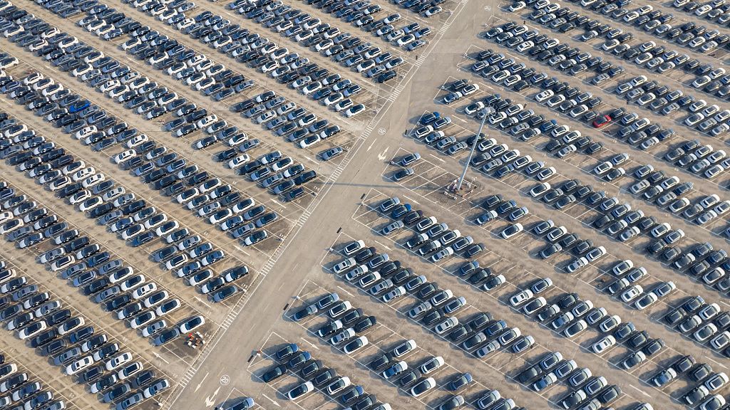 The aerial photo shows new energy vehicles parked in a parking lot, southwest China's Chongqing Municipality, July 8, 2023. /CFP