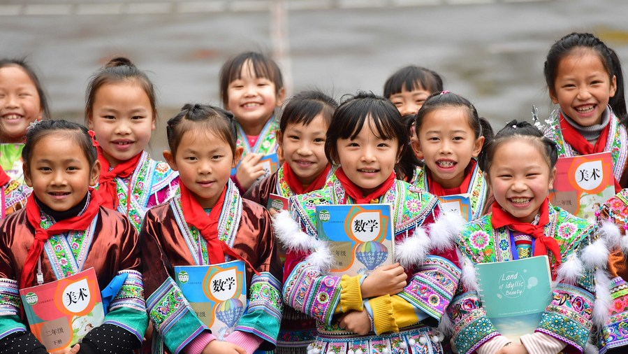 Students pose for a photo at a primary school in the Gandong Township of the Rongshui Miao Autonomous County, south China's Guangxi Zhuang Autonomous Region, March 14, 2019. /Xinhua 