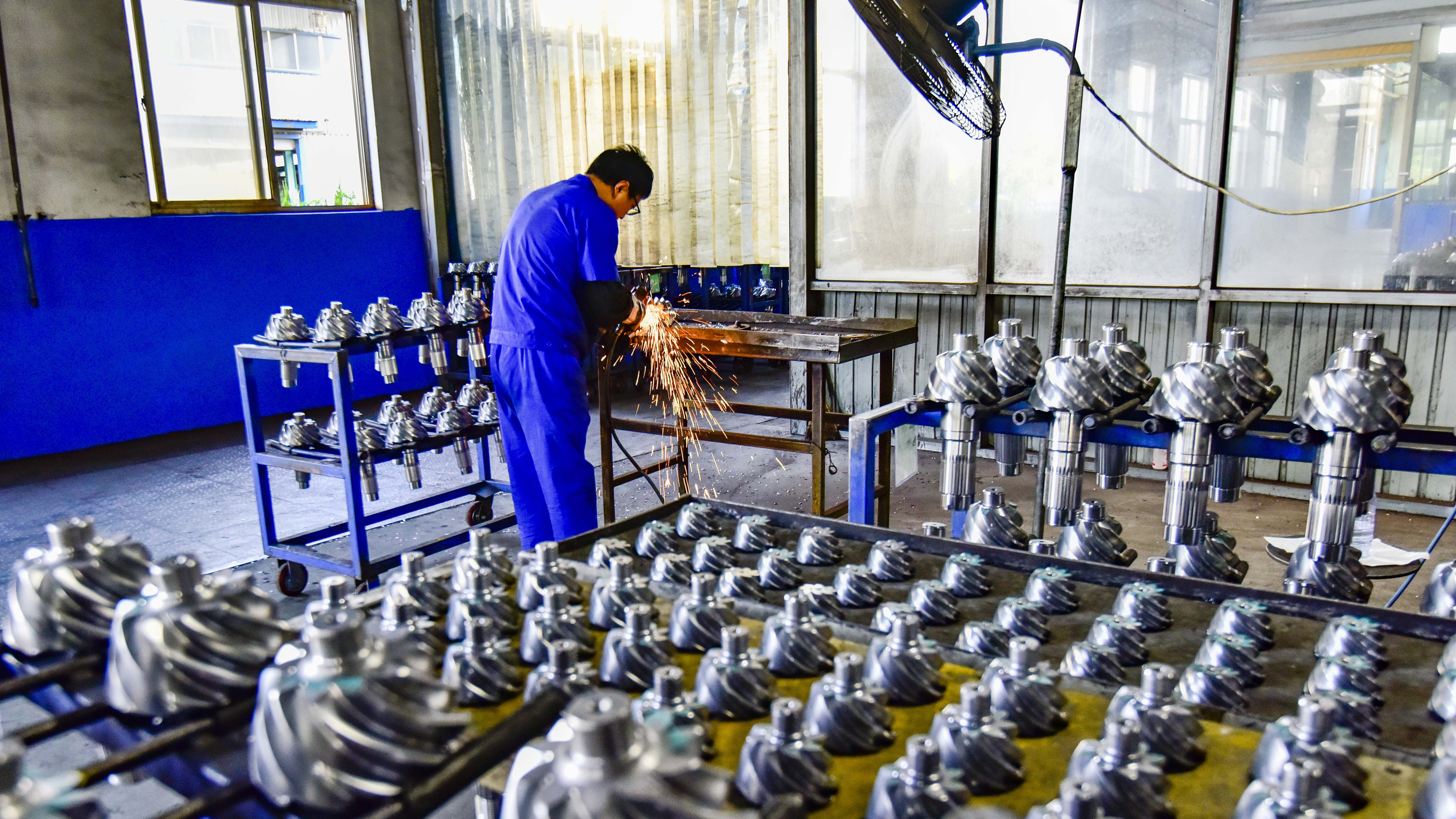 An employee processes products at a gear manufacturing enterprise in Qingzhou Economic Development Zone, Qingzhou City, east China's Shandong Province, September 30, 2023. /CFP