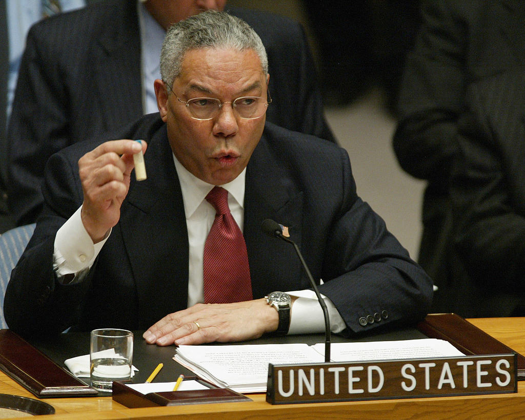 Then U.S. Secretary of State Colin Powell holds up a vial as the evidence of 