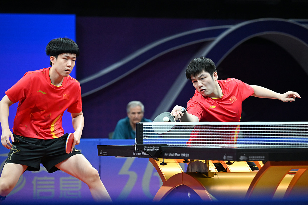 Wang Chuqin (L) and Fan Zhendong in action during Hangzhou Asian Games table tennis men's doubles semifinal in Hangzhou, east China's Zhejiang Province, October 1, 2023. /CFP