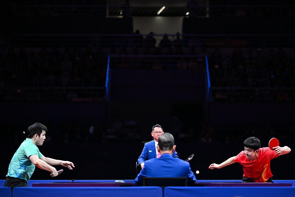Wang Chuqin (R) and Fan Zhendong of China compete in the table tennis men's singles final at the 19th Asian Games in Hangzhou, east China's Zhejiang Province, October 2, 2023. /CFP