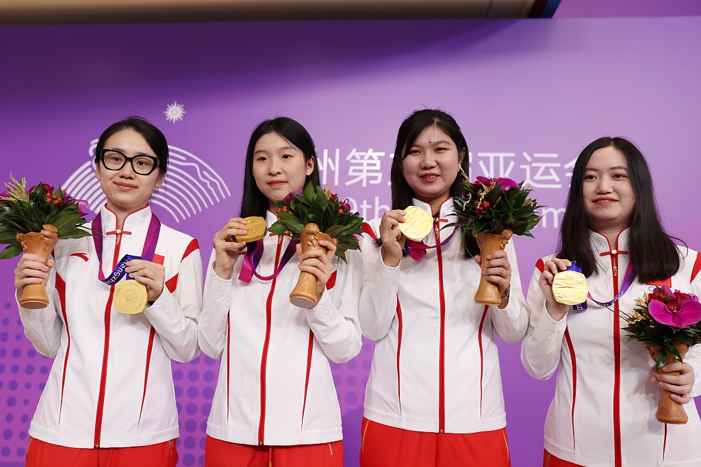 L-R: Li He, Wu Yiming, Wang Yubo and Yu Zhiying win the women's team gold medals in Go during the 19th Asian Games in Hangzhou, China, October 3, 2023. /CFP 