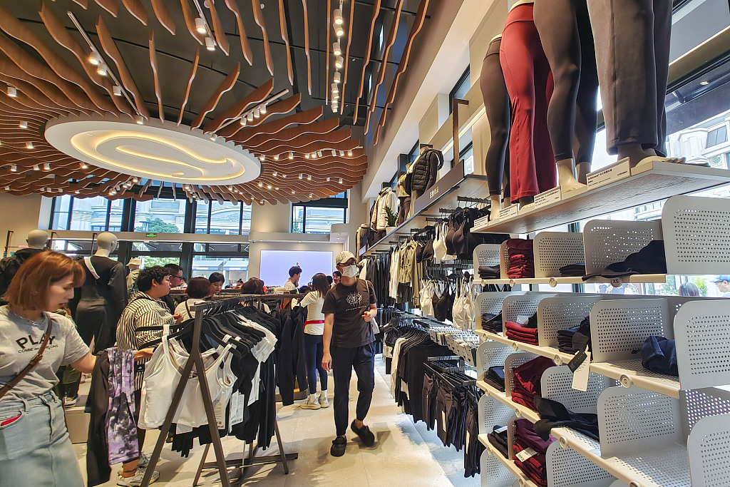 People shop at the store of Lululemon, a Canadian brand, in Bicester Village in Shanghai, east China, October 3, 2023. /CFP