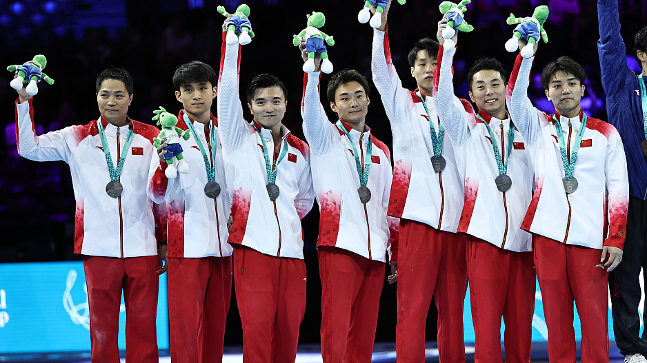 Team China celebrate winning men's team silver at the Artistic Gymnastics World Championships in Antwerp, Belgium, October 3, 2023. /CFP