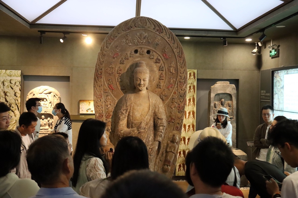 Visitors view an exhibit at the Beijing Stone Carving Art Museum on October 4, 2023 in Beijing. /IC