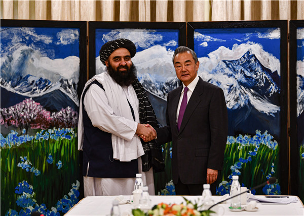 Senior Chinese diplomat Wang Yi (R) shakes hands with Mawlawi Amir Khan Muttaqi, acting foreign minister of the Afghan interim government in Nyingchi, China's Xizang Autonomous Region, October 5, 2023. /Chinese Foreign Ministry