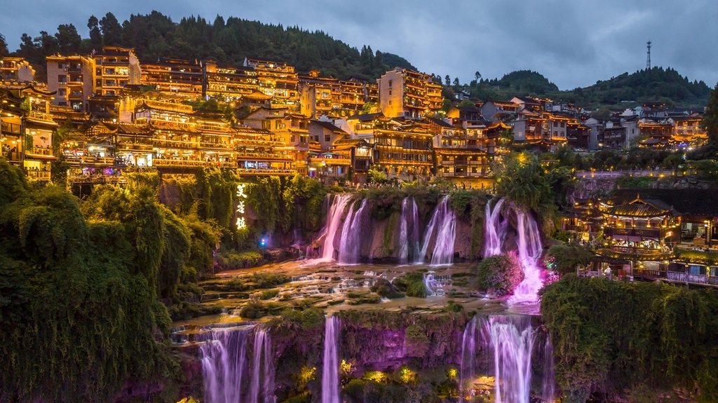 A photo shows the cascading waterfalls of Furong Town on October 4, 2023 in Xiangxi, Hunan. /IC