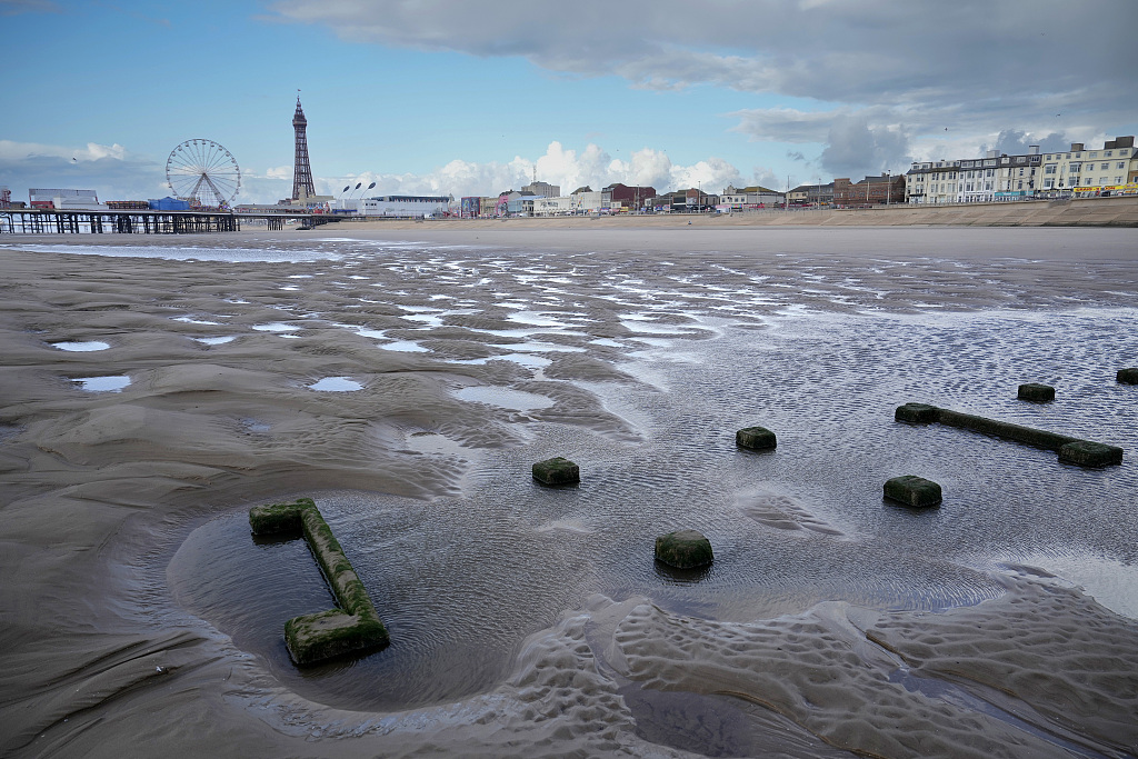 Pipe structure buried under the sand after a storm near Blackpool's Central Pier on September 18, 2023 in Blackpool, the United Kingdom. /CFP