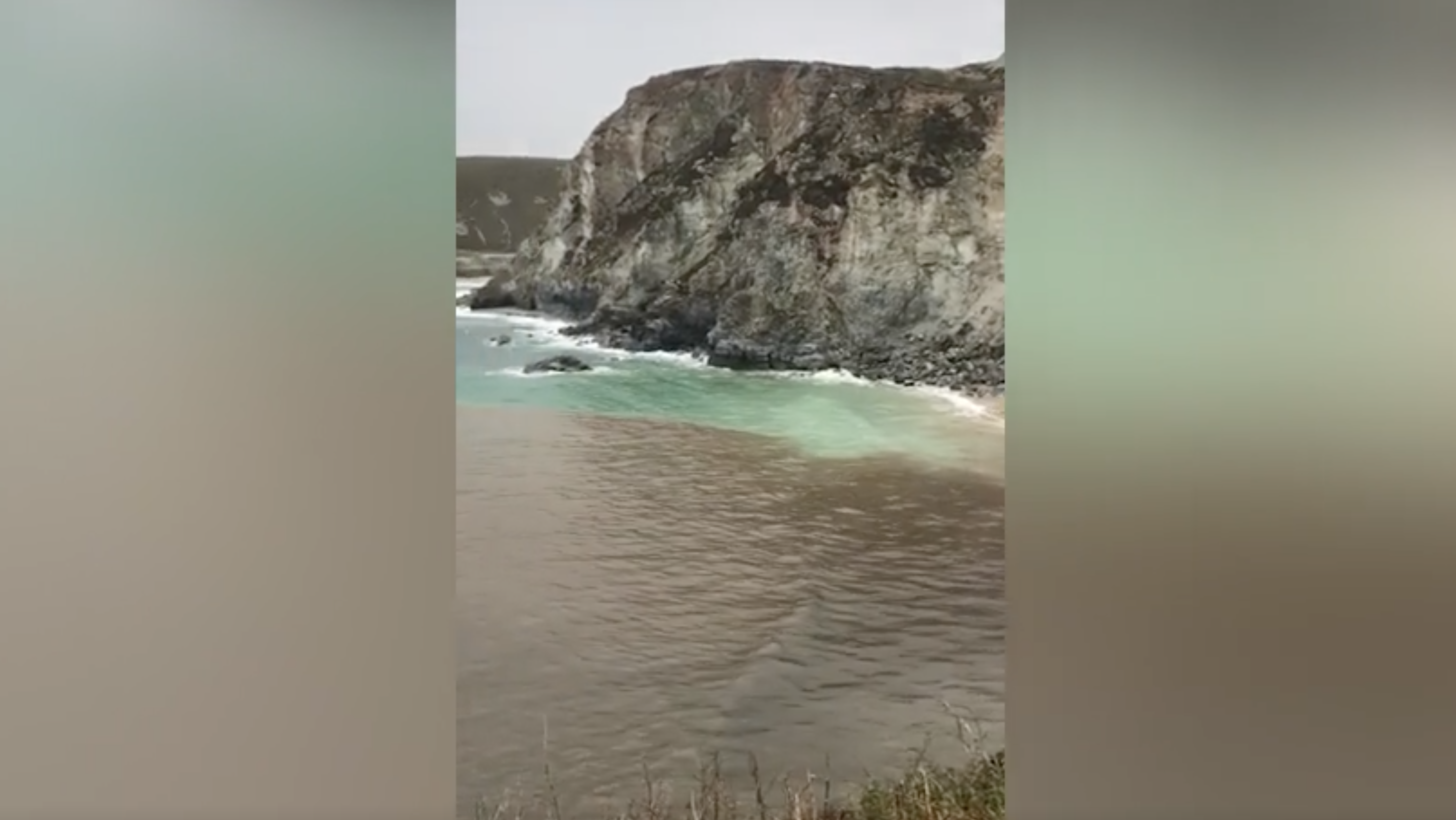 Screenshot of video showing sewage discharged into ocean at Cornwall Beach in southwest England. /CMG