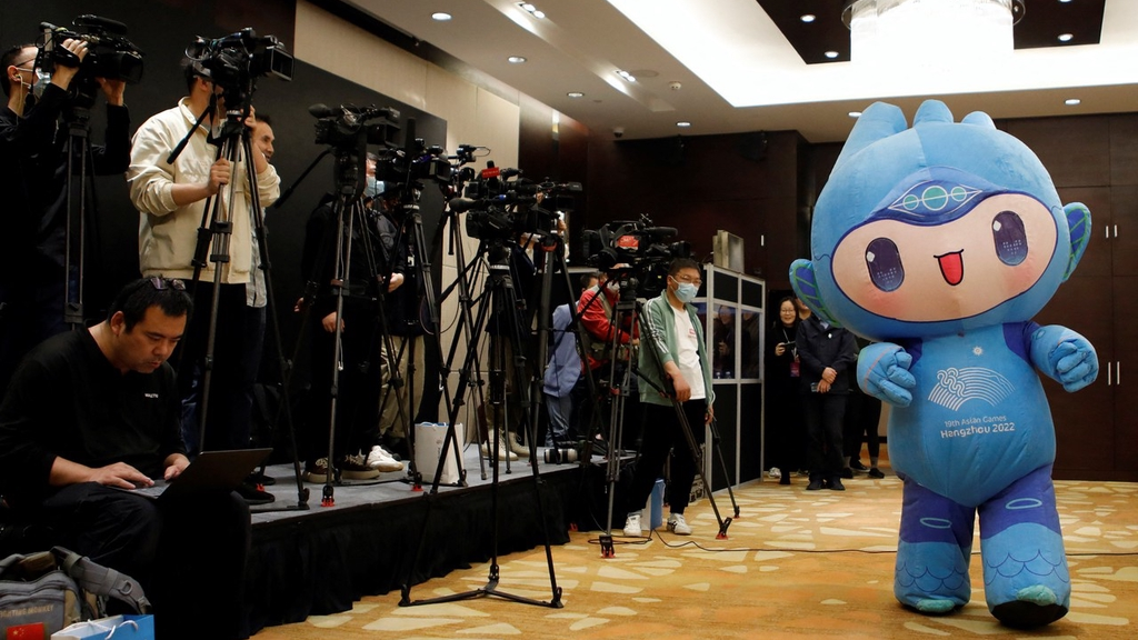 A photo taken on April 27, 2023 shows the mascot Chenchen making an appearance in Beijing at a media briefing for the 19th Asian Games. /IC

