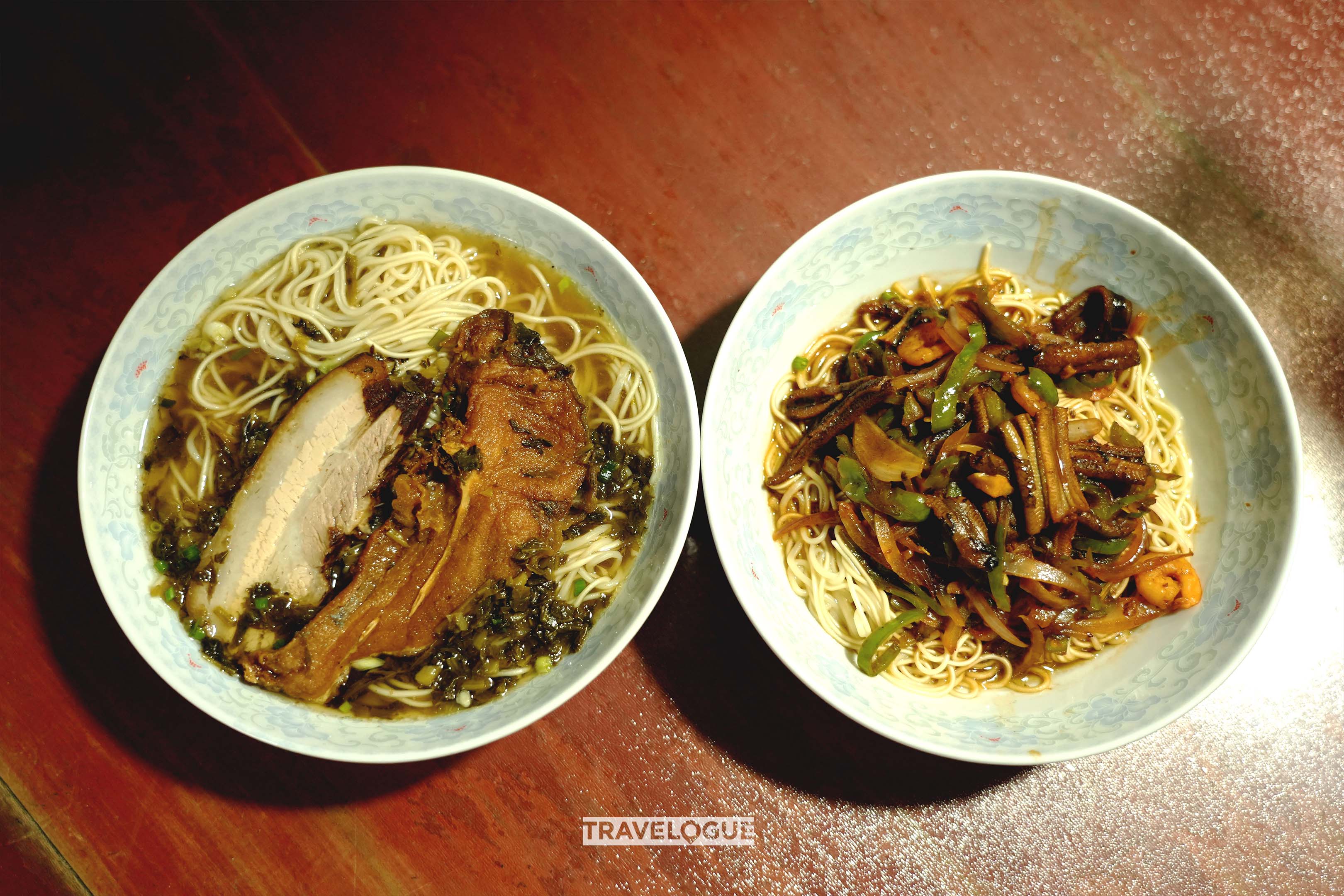 An undated photo shows two bowls of Nanxun noodles featuring different toppings: a fried fish and a slice of crispy pork (left), and fried eels (right). /CGTN