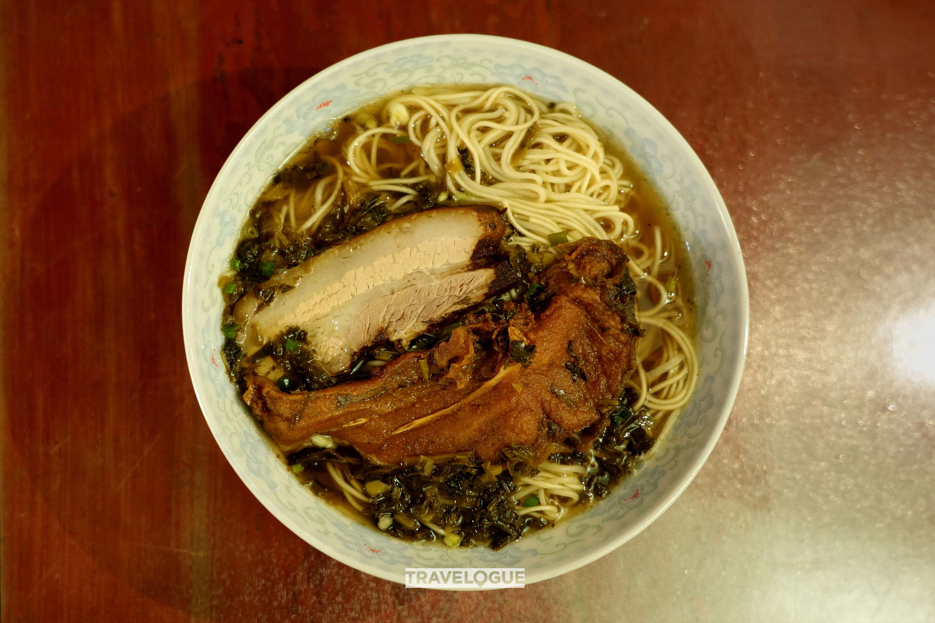 An undated photo shows a bowl of Nanxun noodles topped with a fried fish and a slice of crispy pork. /CGTN